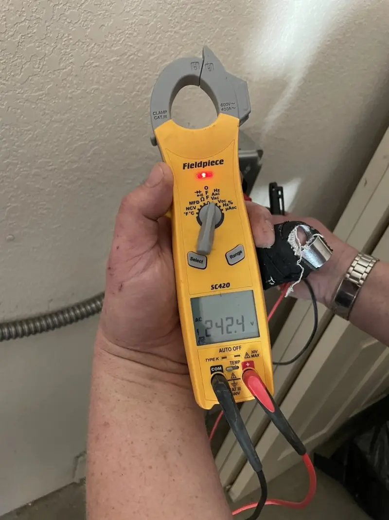 Voltage testing with clamp meter during Outlet Installation in Long Grove